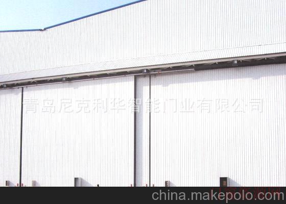 青岛市城阳区黑龙江中尼克利华销售各种优质型车间、厂房专用电动工业门保温、隔音_18866255158